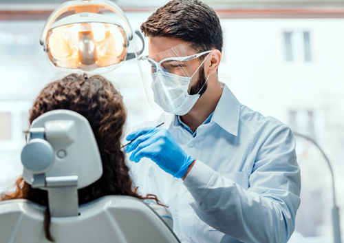 Dentist working in dental clinic