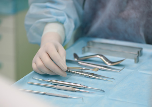 surgeon preparing for a tooth implantation and sinus lifting