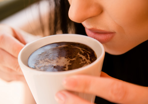 young woman enjoying coffee
